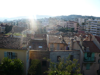 Image showing France. French Riviera. Cannes. Picturesque roofs of the houses in sun beams  