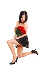 Image showing Chinese girl kneeling in black dress.