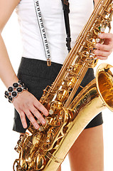 Image showing Chinese girl playing the saxophone.