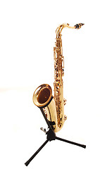 Image showing An brass saxophone on the stand.