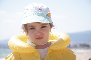Image showing Girl in yellow life jacket
