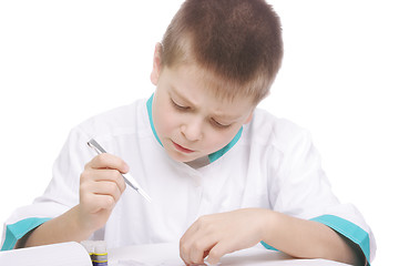 Image showing Boy working with tweezers