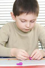 Image showing Kid with plasticine