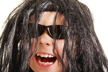 Image showing Laughing boy in black wig