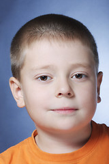 Image showing Serene boy in orange