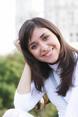 Image showing Smiling woman leaning on hand