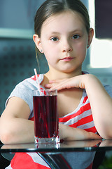 Image showing Little girl with juice