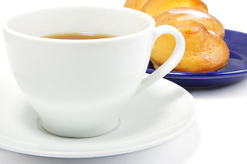Image showing Tea and bun closeup