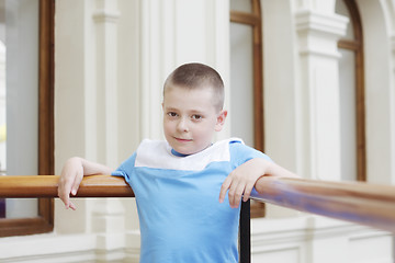 Image showing Boy leaning on banister