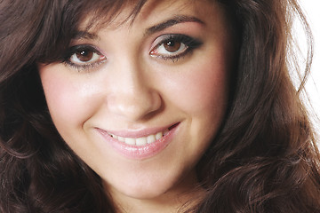 Image showing Smiling brunette with fluffy hair