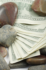 Image showing Money and pebbles