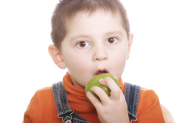 Image showing Surprized boy with green apple