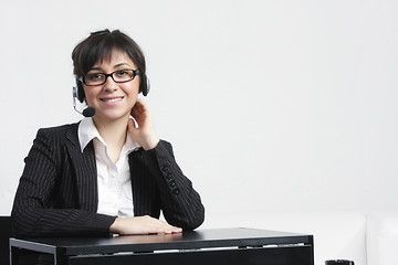 Image showing Businesswoman sitting at desk alone