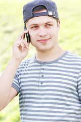 Image showing Serene guy with phone