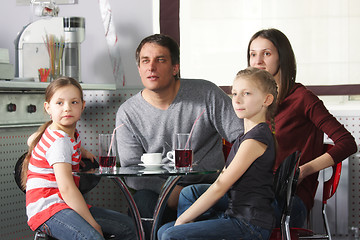 Image showing Family in cafe looking aside