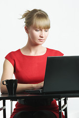 Image showing Businesswoman in red typing on laptop