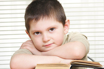 Image showing Serene boy with book