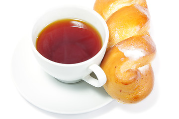 Image showing Bun at tea cup