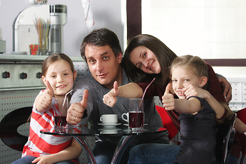 Image showing Family in cafe showing thumbs up