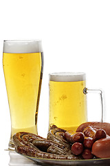 Image showing Grilled sausages and beer