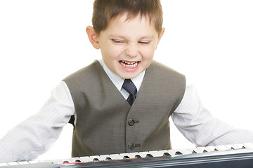 Image showing Expressive little pianist