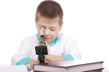 Image showing Boy looking into microscope