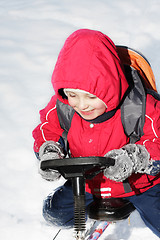 Image showing Smiling kid on sledge