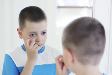 Image showing Boy at mirror