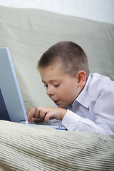 Image showing Boy typing on laptop