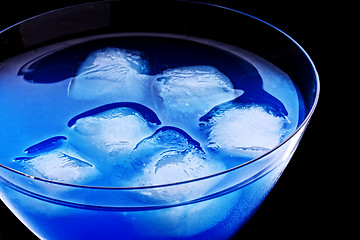 Image showing Ice cubes in blue cocktail