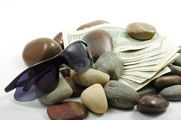 Image showing Money pebbles and sunglasses