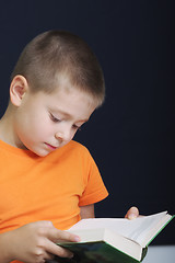 Image showing Kid reading book