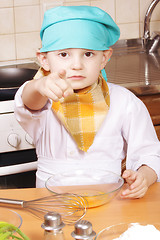 Image showing Serious cook pointing forefinger