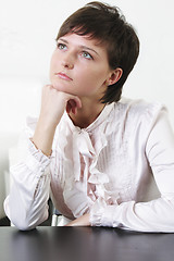 Image showing Serene young woman looking up