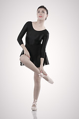 Image showing Ballerina rubbing hurt foot