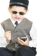 Image showing Vexed kid with palm computer and stylus