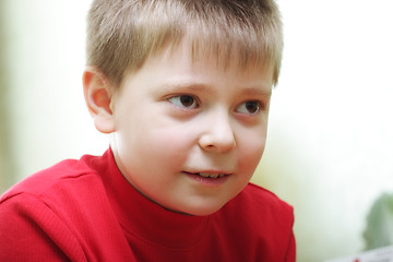 Image showing Boy in red looking forward