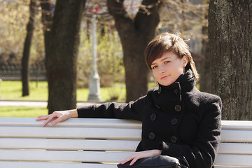 Image showing Serene woman in black on bench