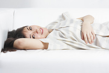 Image showing Serene brunette relaxed on sofa