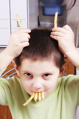 Image showing Fried potato horns and teeth