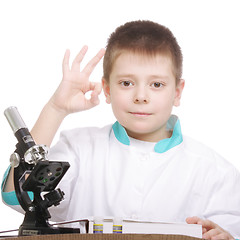 Image showing Researcher with book showing okay gesture