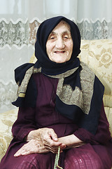 Image showing Portrait of smiling senior with beads