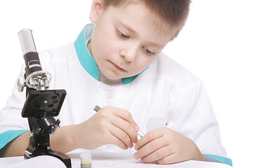 Image showing Boy with tweezers and microscope