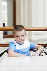 Image showing Serene boy at table