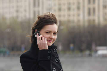 Image showing Businesswoman with cellphone in city