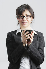 Image showing Brunette businesswoman with black cup