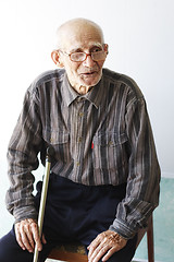 Image showing Senior man sitting on chair