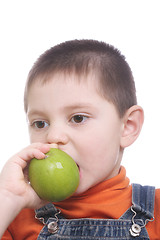 Image showing Kid biting apple