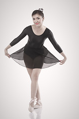 Image showing Smiling ballerina making a bow