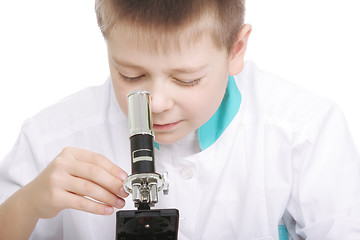 Image showing Kid tuning microscope